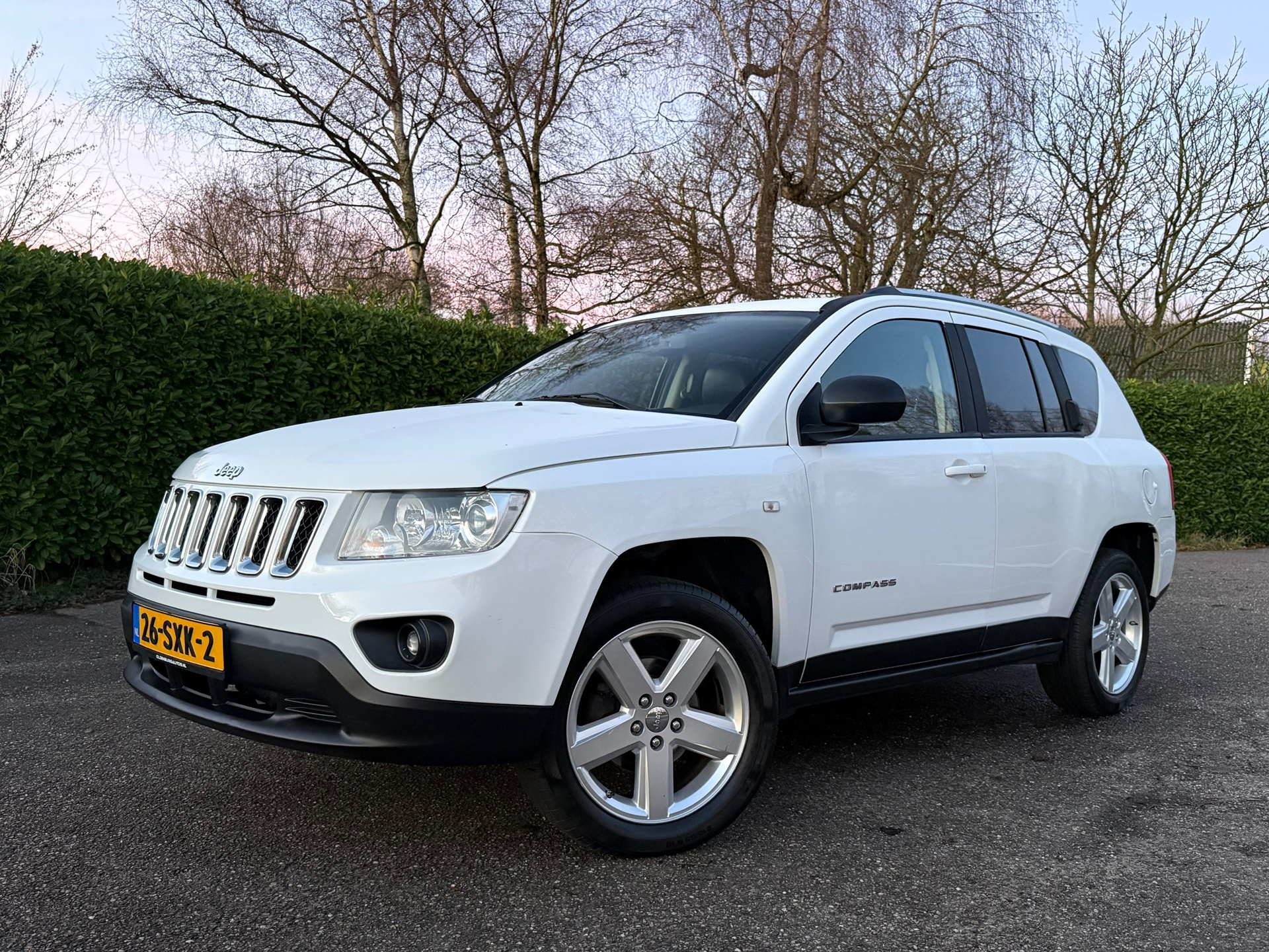 Jeep Compass 2.4 Limited 4WD Automaat | Leder | Trekhaak | Clima | 18" Velgen | Stoelverwarming | PDC | Cruise | 49995522-0.jpg | Auto rijser